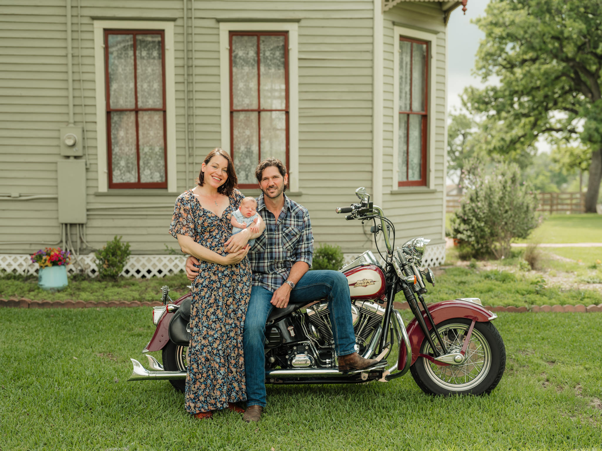new family sitting on motorcycle 